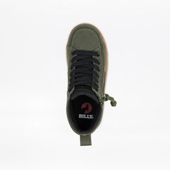 Green sneaker with black laces on a white background