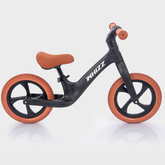 Black balance bike with orange wheels on a white background