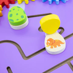 Colorful children's puzzle with dinosaur design on a purple surface