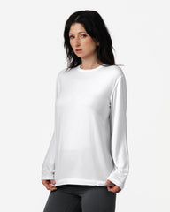 Woman wearing a white long-sleeve shirt against a white background