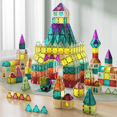 Colorful magnetic building blocks on a wooden surface with a light gray background