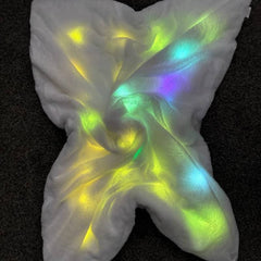 Glowing multicolored fabric on a dark background