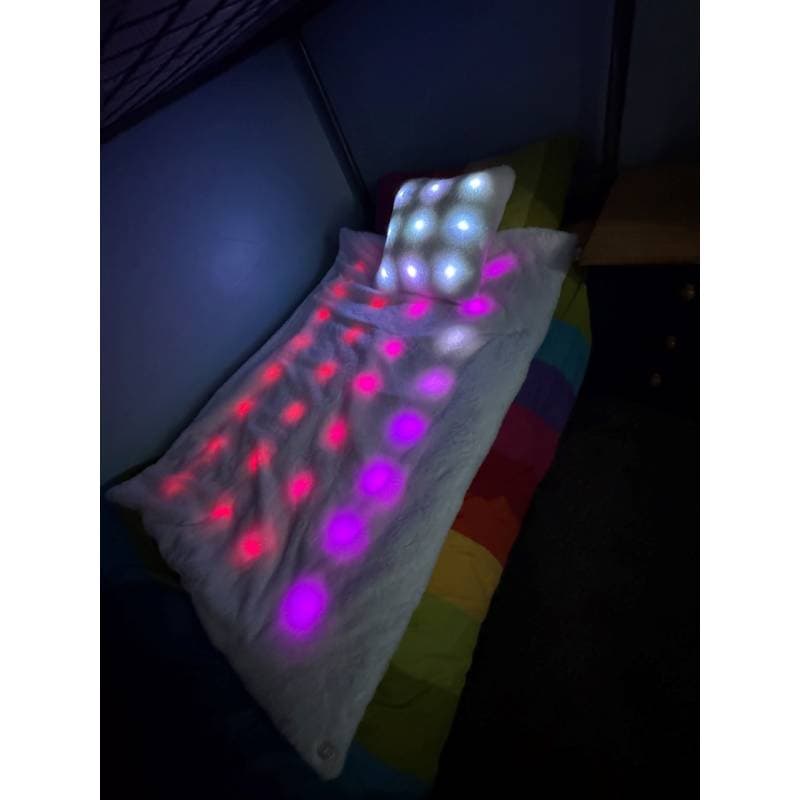 Colorful LED pillow with multicolor lights on a dark background