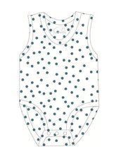 Polka dot tank top with a visible brand logo on a white background