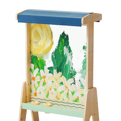 Children's art easel with painted design of flowers and sun on a white background