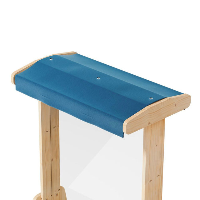 A wooden horse jump with a blue padded top and natural wood legs, shown against a plain white background.
