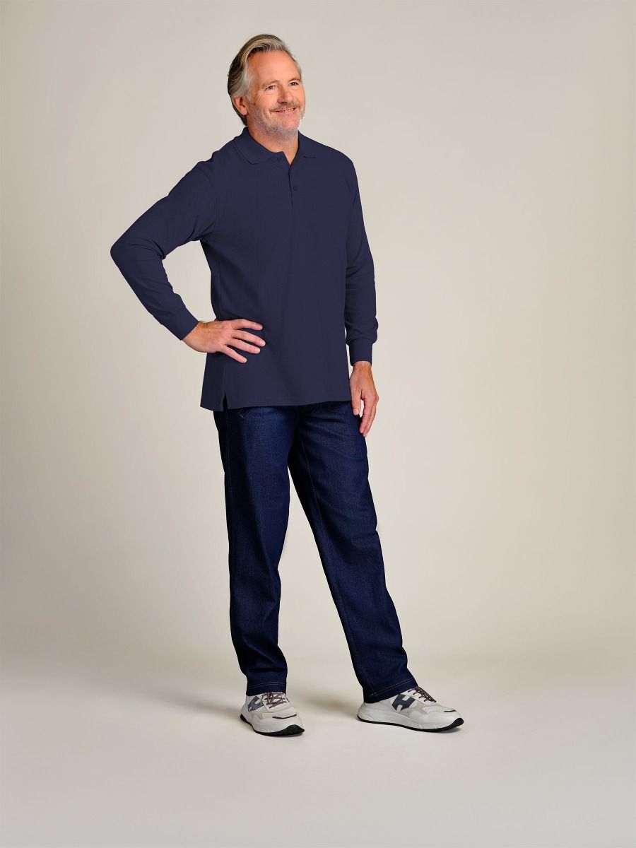 A man modeling a navy blue long-sleeve quarter-zip pullover and matching navy pants, standing against a neutral light gray studio background.