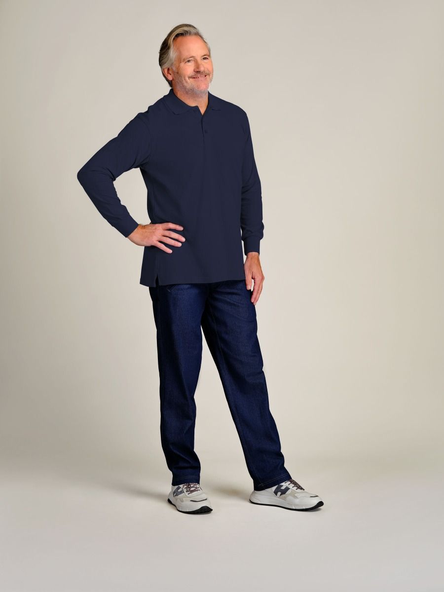 A man modeling a navy blue long-sleeve quarter-zip pullover and matching navy blue pants, standing against a neutral light beige studio background.