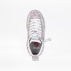 A single high-top sneaker covered in silver glitter, featuring white laces and a pull tab, shown from a top-down view on a white background. The insole displays the brand name 'BILLY.