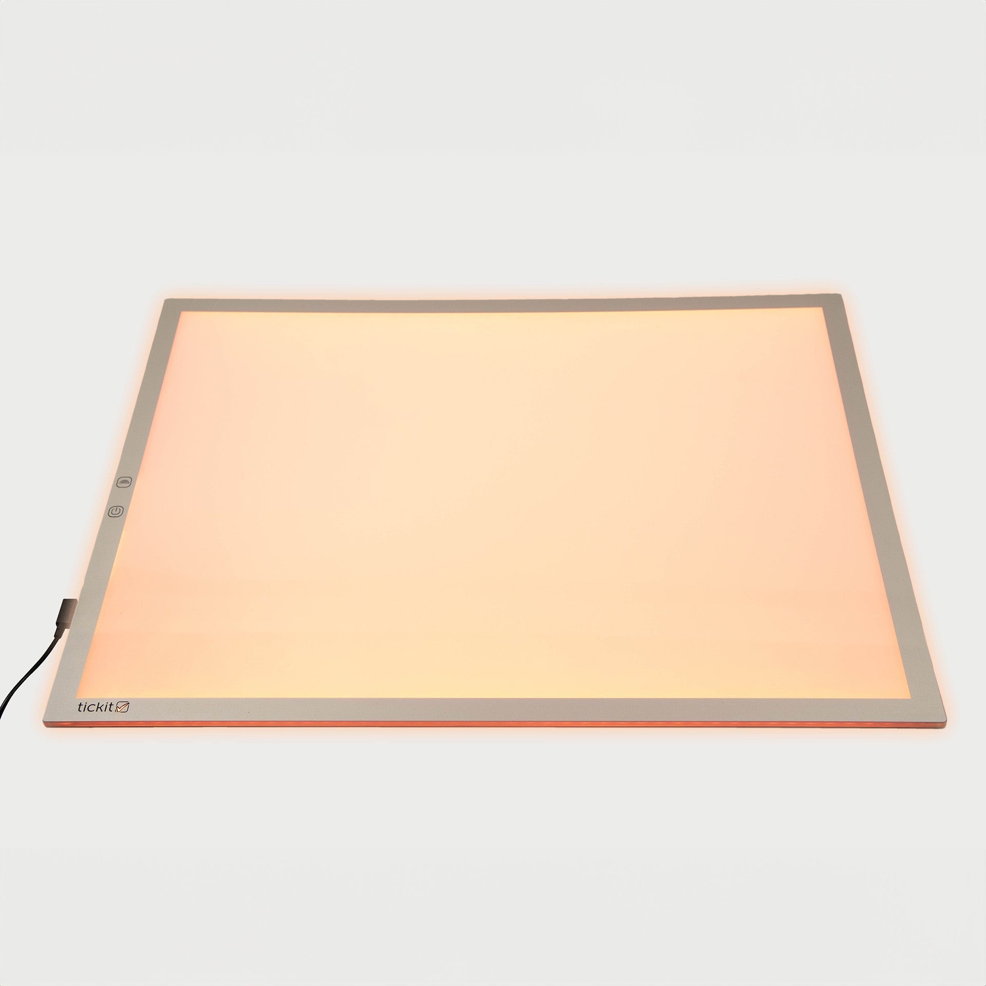 Rectangular light pad with a beige surface on a white background