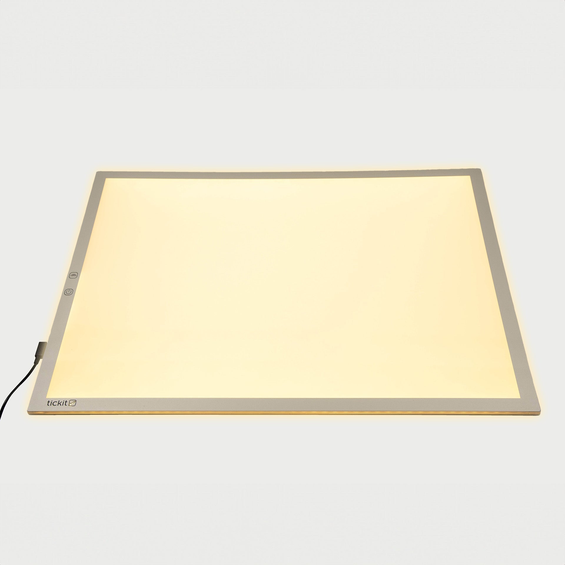 Rectangular light pad with a beige surface on a white background