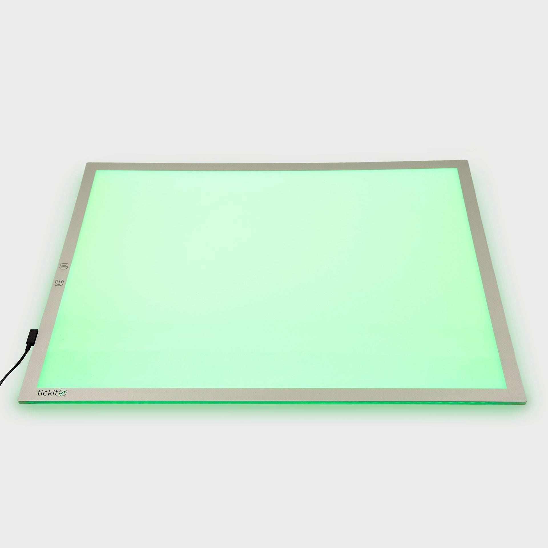 Light pad with green glow on a white background