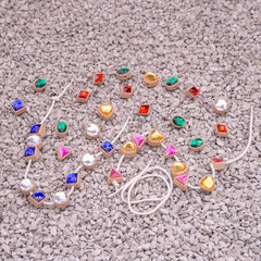 Colorful gemstone necklace on a textured surface