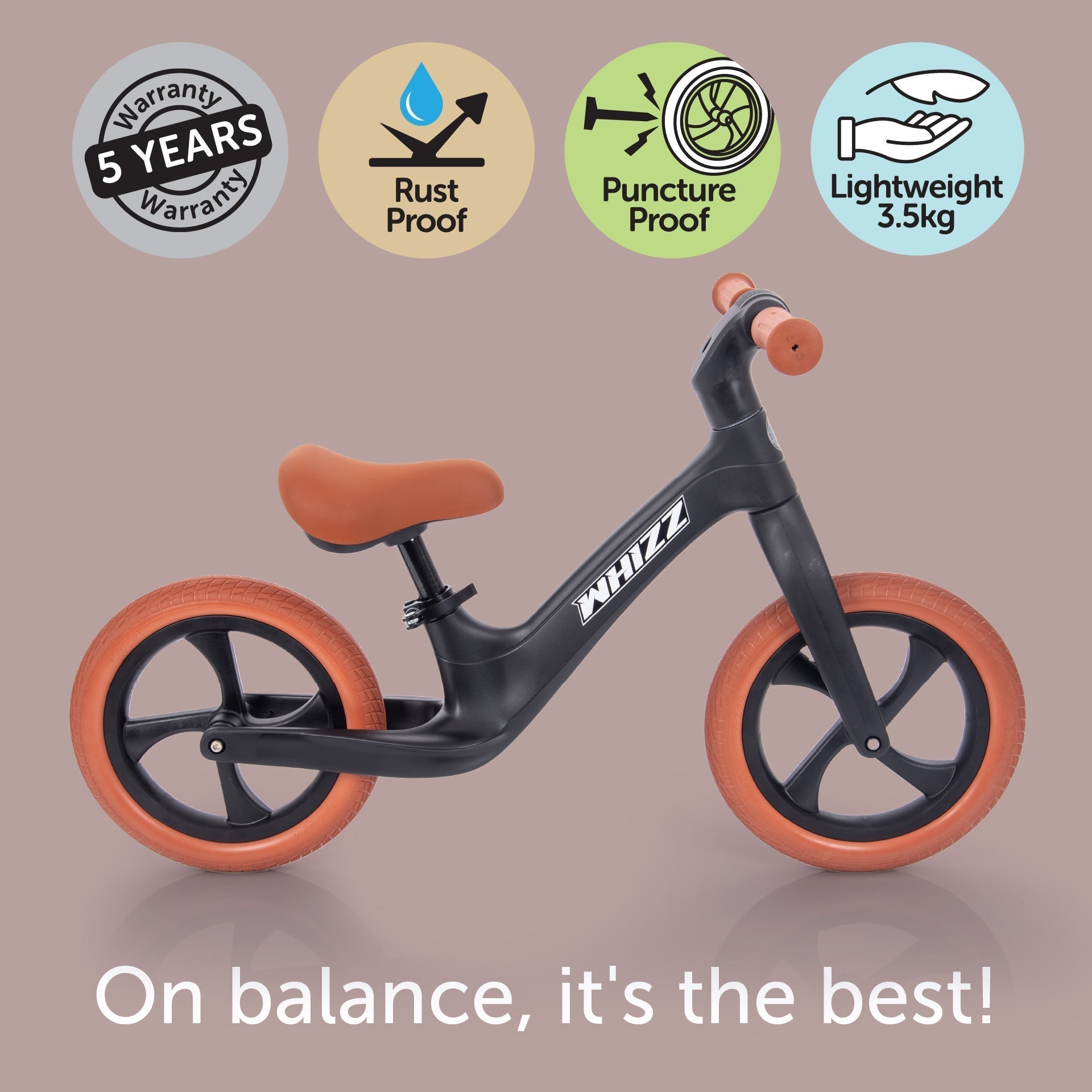 Black balance bike with orange wheels on a brown background, featuring certification icons and text.
