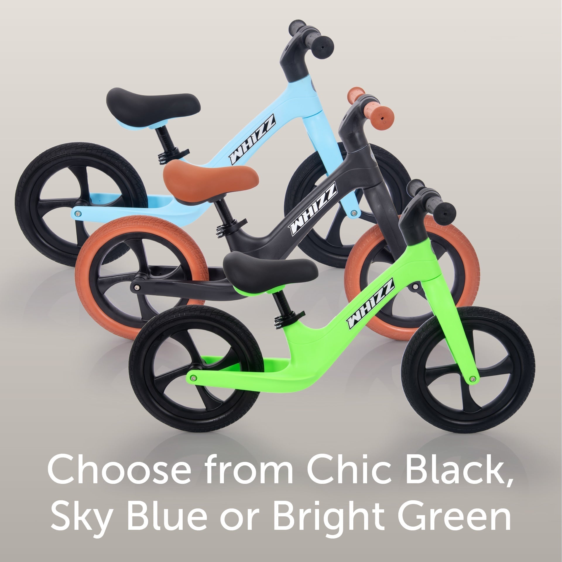 Three balance bikes in different colors on a light gray background