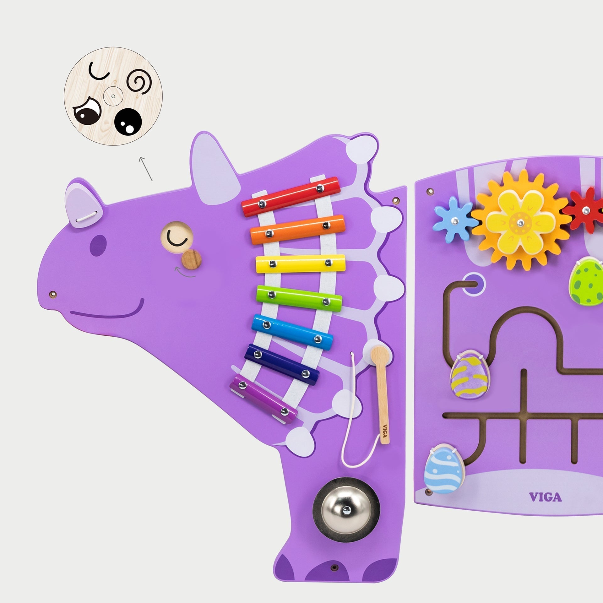 Purple toy cow with various educational components on a white background
