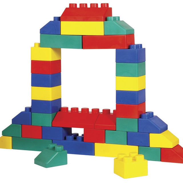 Colorful plastic building blocks arranged to form an arch structure on a plain white background.