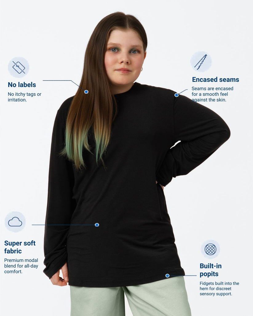 Woman wearing a black long-sleeve shirt with text highlighting features on a white background