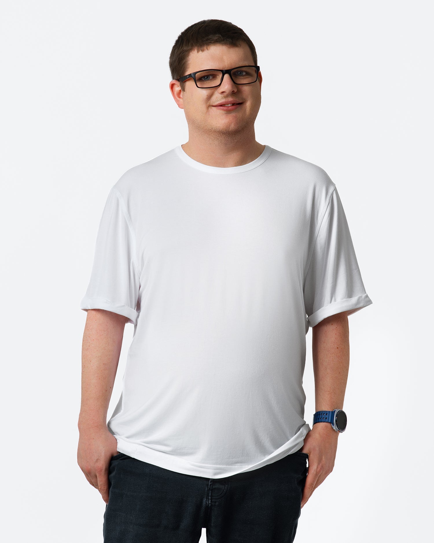 Person wearing a plain white t-shirt on a light gray background