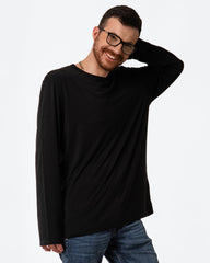 Man wearing a black long-sleeve shirt and glasses on a white background