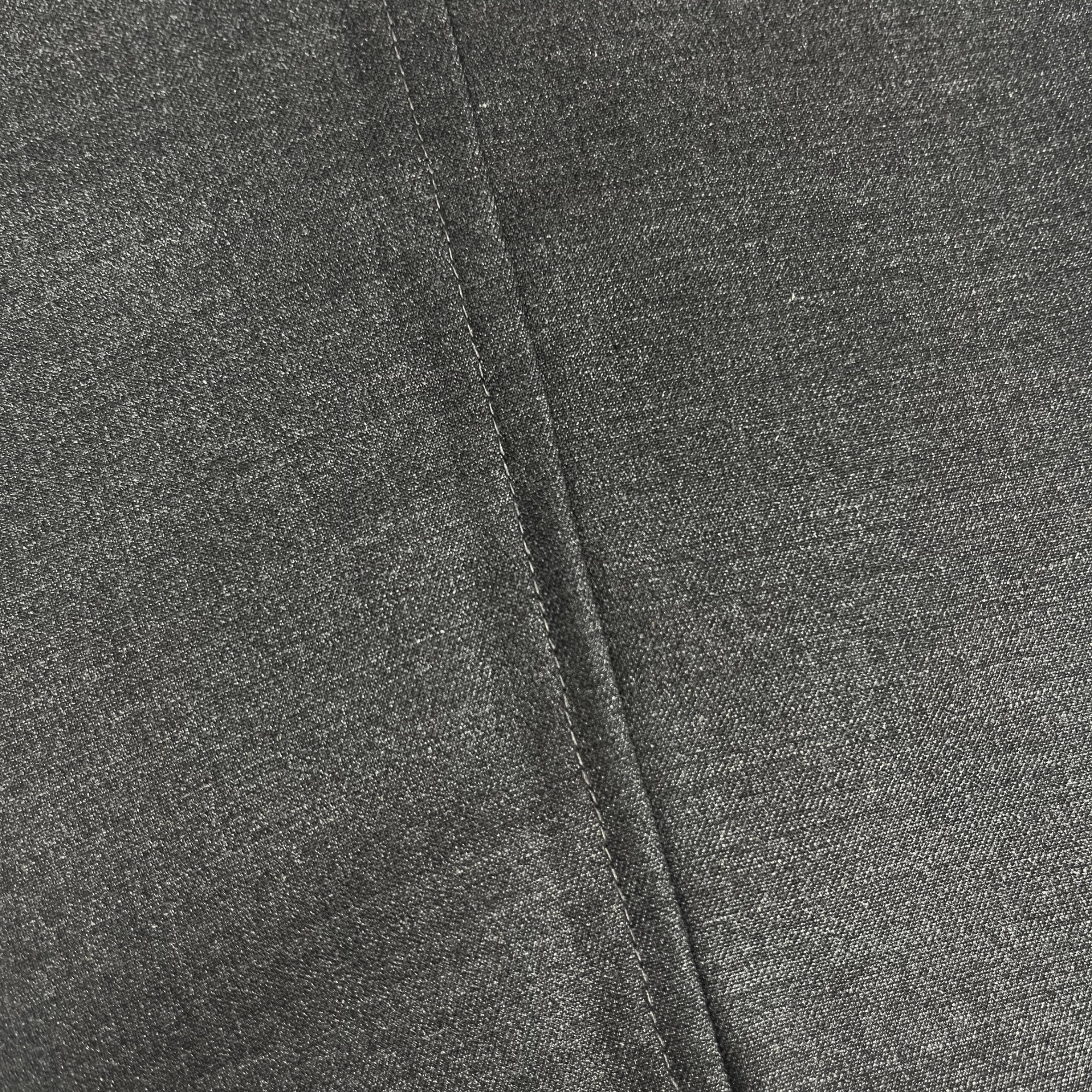 Close-up of gray fabric with a visible seam