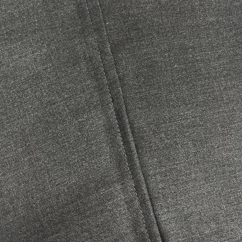Close-up of gray fabric with a visible seam