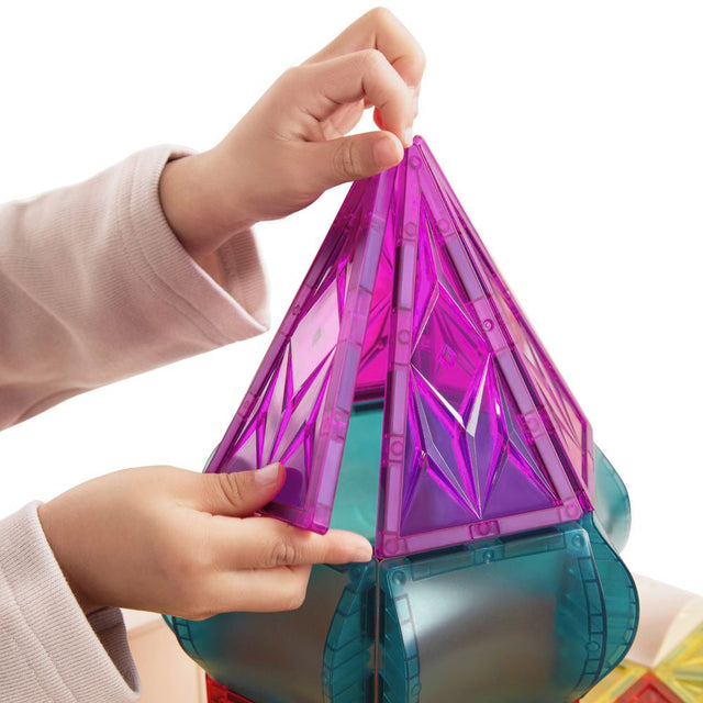 Child's hands holding a colorful geometric toy structure