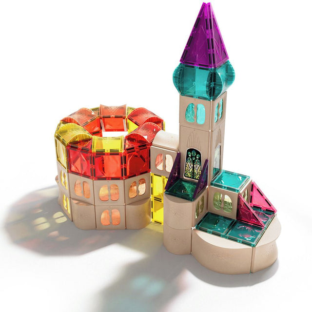 Colorful toy castle with transparent sections on a white background