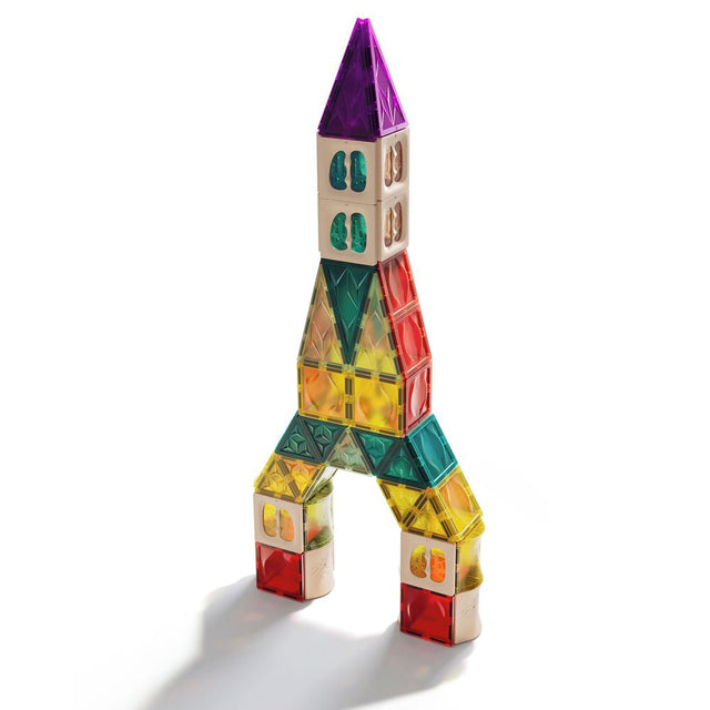 Colorful magnetic building block tower on a white background