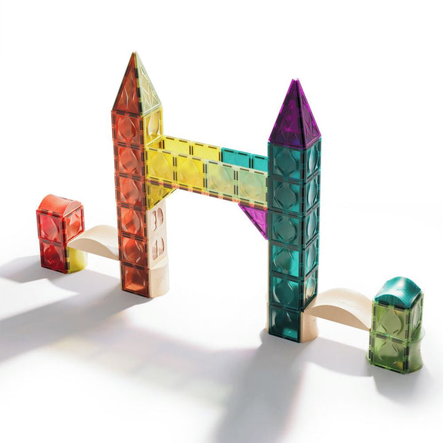 Colorful magnetic building blocks on a white background