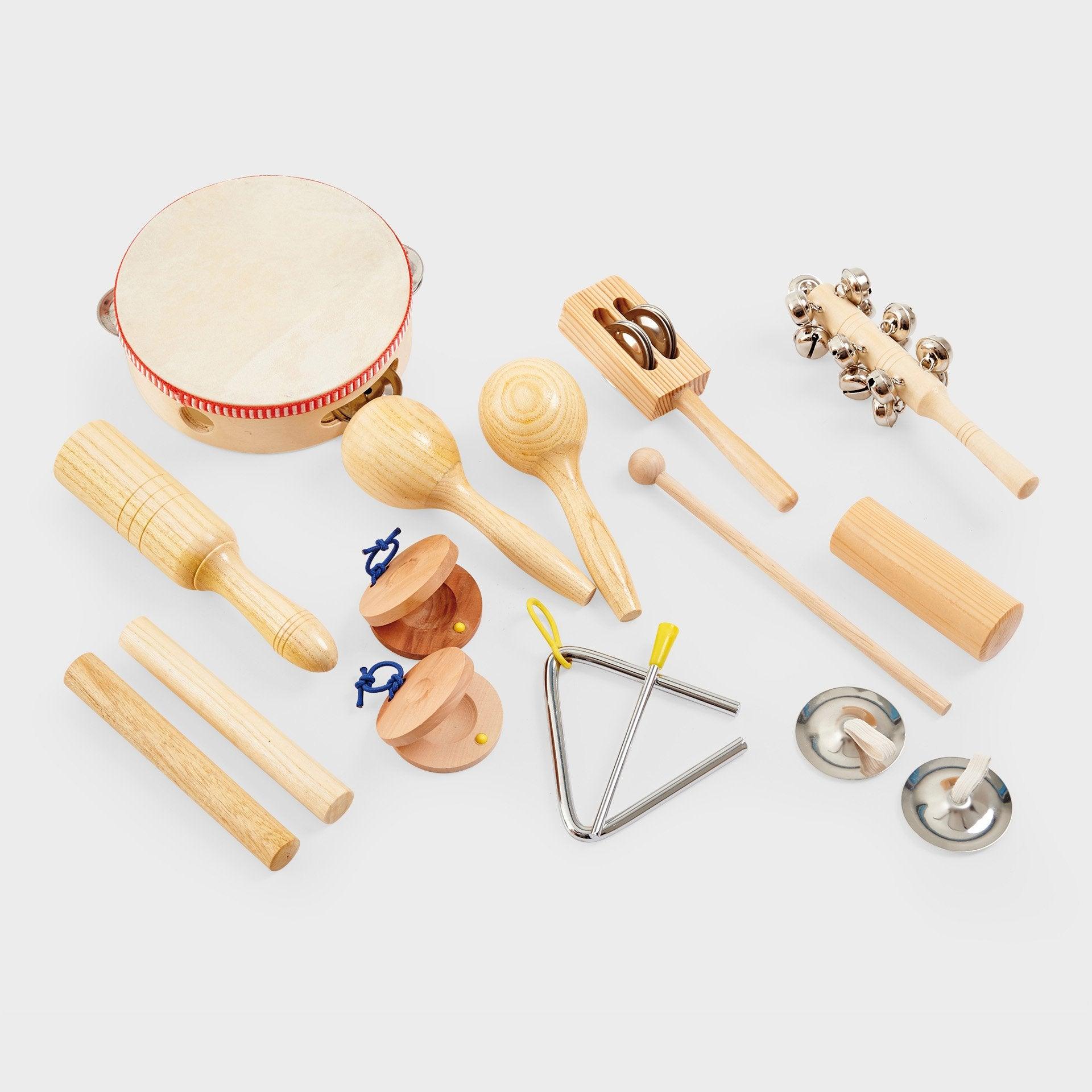 Collection of wooden musical instruments on a light gray background