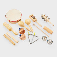 Collection of wooden musical instruments on a light gray background