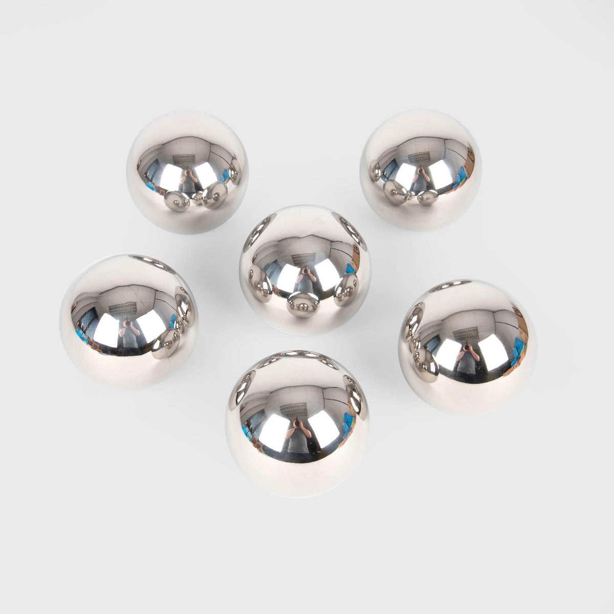 Set of silver metallic balls on a white background