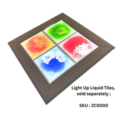 A square frame holding four illuminated liquid tile panels in orange, green, red, and blue, shown on a white background with text noting the tiles are sold separately and an SKU.
