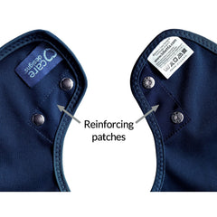 Navy blue fabric with reinforcing patches and Care label on a white background