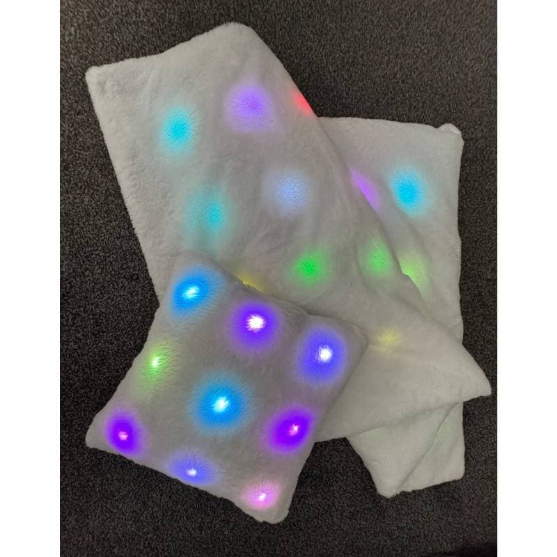 blanket and cushion on a dark background